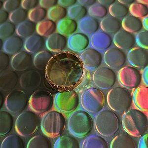 NEW Goldtone Ring,stamped 14k. Size 5.